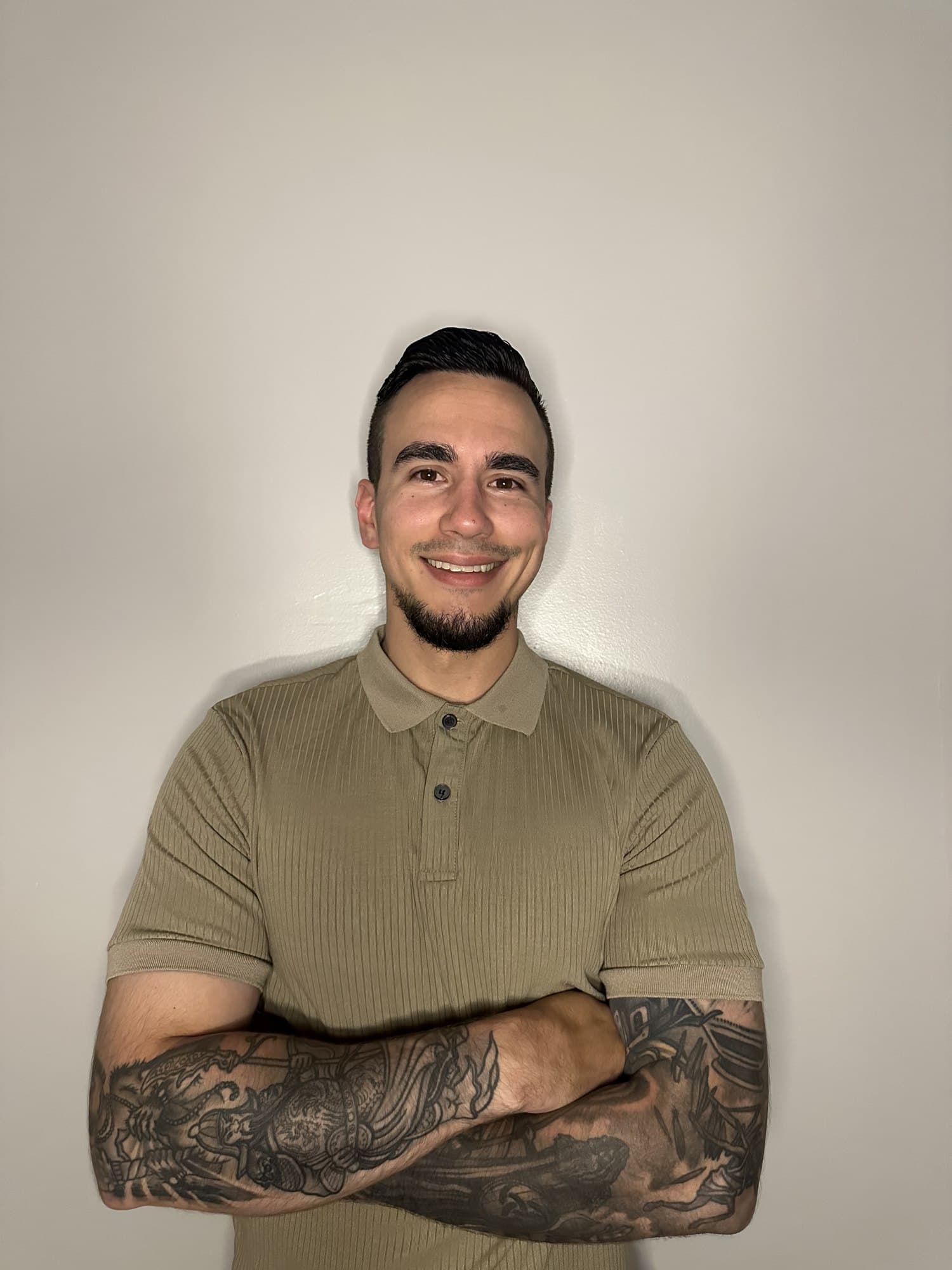 Jarrid Crocker, smiling, arms crossed